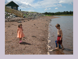 Beachcombing Children on the north shore of Nova Scotia, Atlantic Canada