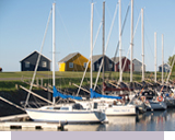 Yachts and Sailing Boats docked at Sunrise Marina Cottages Seaside Resort 